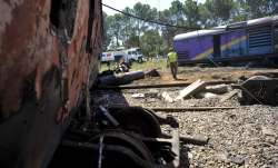 Ruined carriages at the scene of a train accident near