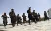 Taliban fighters patrol in Kabul, Afghanistan, Thursday,