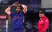 Indian pacer Jasprit Bumrah reacts after bowling a delivery against New Zealand in Dubai on Sunday.